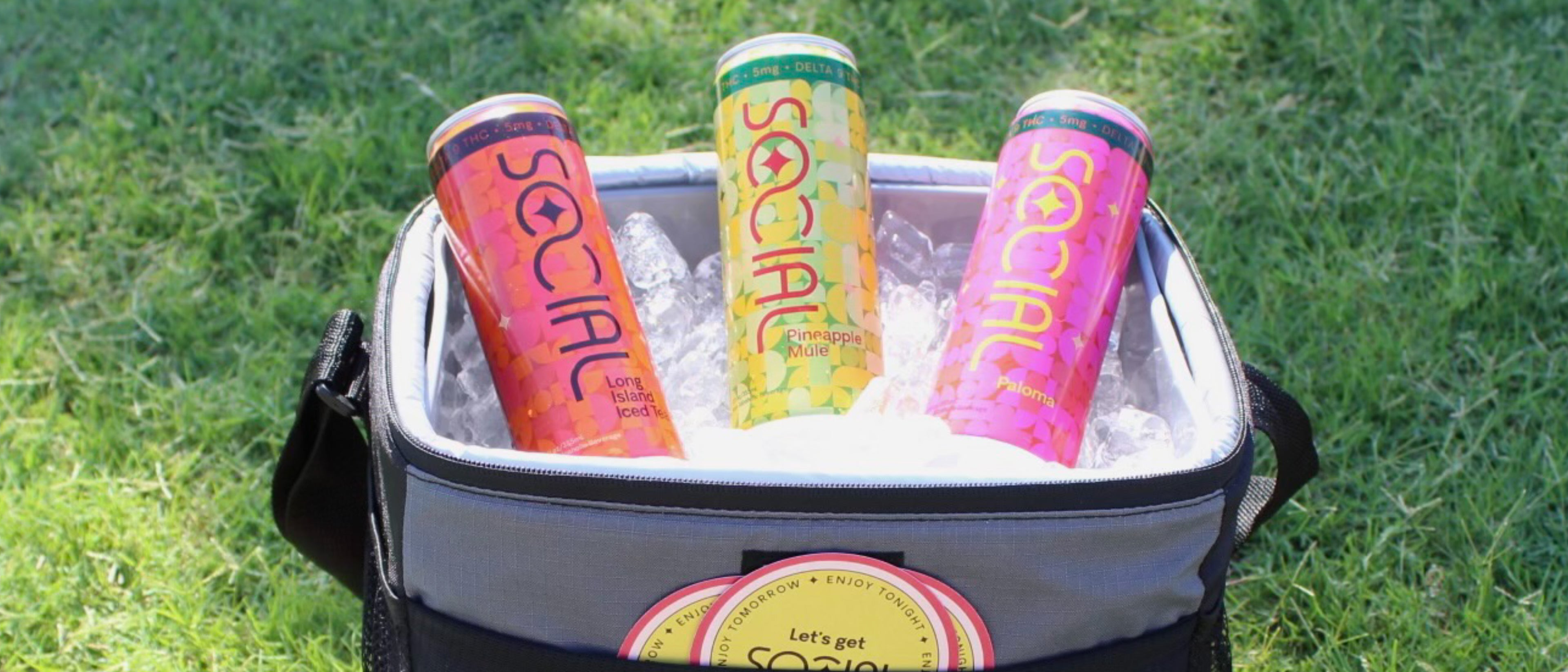 SOCIAL Hemp-derived Delta 9 THC beverages sitting in soft cooler with coasters, Long Island, Pineapple Mule, and Paloma flavors, refreshing legal cannabis beverage hemp drink